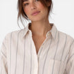 Lightweight women's striped button-down shirt by FJØRNA featuring a relaxed fit and classic design.