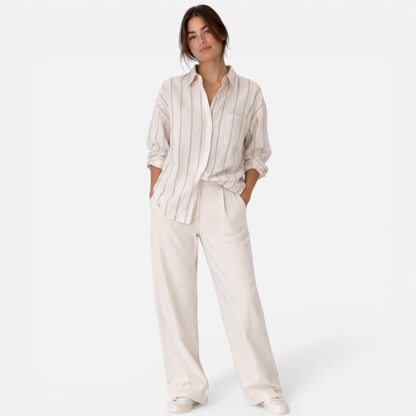 Women's striped button-down shirt by FJØRNA, relaxed fit, lightweight blouse with vertical stripes, ideal for casual wear.