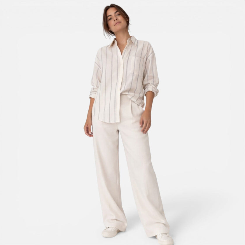 Women's FJØRNA striped button-down shirt with a relaxed fit, lightweight fabric, perfect for casual or office wear.