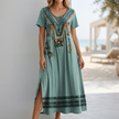 FJØRNA bohemian blue-green A-line scoop neck maxi dress for women, flowing and stylish for casual or special occasions.