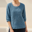 FJØRNA women's summer blouse in blue floral cotton, lightweight top with a relaxed fit and feminine floral pattern.