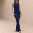 Blue ribbed bodycon high neck sleeveless maxi dress for women by FJØRNA, shown on a model highlighting its fitted silhouette.