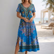 Blue FJØRNA bohemian A-line scoop neck maxi dress for women, flowing style with a relaxed fit and elegant design.
