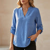 Blue V-neck linen summer blouse for women, flowy and lightweight, by FJØRNA, perfect for warm weather and casual style.