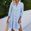 Blue gingham summer dress for women by FJØRNA featuring a V-neck and sleeveless design.