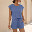 Blue women's summer two-piece co-ord set with pockets, featuring a stylish top and matching shorts from FJØRNA.