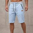 Men's blue tailored relaxed-fit work shorts by FJØRNA, showing the comfortable, casual fit and durable fabric.