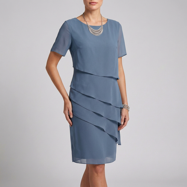 Blue elegant women's dress with ruffle chiffon design by FJØRNA, showcasing a flowing, stylish silhouette.