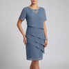 Blue FJØRNA flowing tiered mini dress with ruffled sheer sleeves, showcasing a lightweight, elegant design.