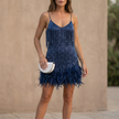Blue FJØRNA fitted V-neck mini dress with sequined fringe and feathered hem, perfect for glamorous evening wear.