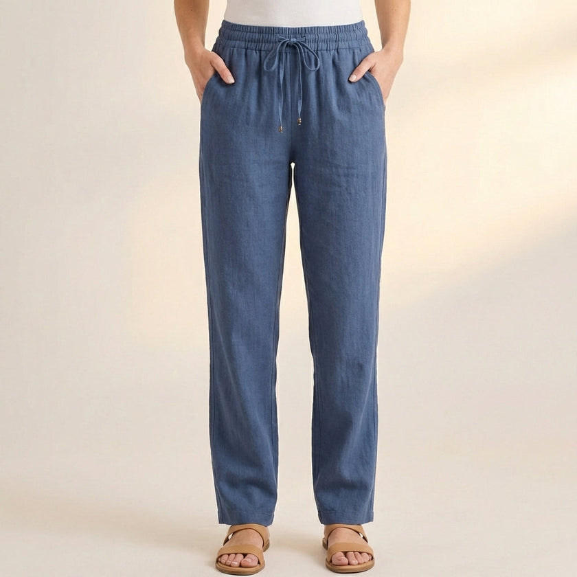 Blue FJØRNA women's summer linen trousers with pockets, lightweight and comfortable for warm weather wear.