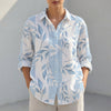 Blue FJØRNA women's tunic shirt with V-neck, collared design and roll-tab sleeves, styled as a casual women's top.