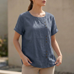 Blue women's summer blouse by FJØRNA, short sleeve linen top with an asymmetric design and relaxed fit.
