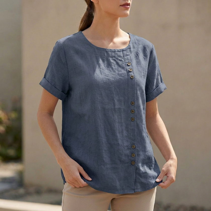 Blue women's summer blouse by FJØRNA, short sleeve linen top with an asymmetric design and relaxed fit.
