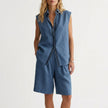 Blue FJØRNA sleeveless button-up shirt and wide-leg pleated shorts set, casual 2-piece summer outfit with relaxed fit.