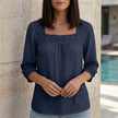 Blue women's summer blouse by FJØRNA featuring a square neckline and lace detailing, perfect for warm-weather styling.