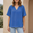 Blue summer blouse for women with v-neck and flutter sleeves, from FJØRNA, styled as a lightweight, casual top.