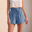 Blue women's linen ruffle summer shorts by FJØRNA, lightweight and stylish with a casual fit for warm weather.