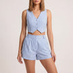 Blue FJØRNA women's two-piece co-ord set with pleated V-neck top and matching skirt, stylish and elegant for women.