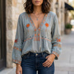 Blue floral V-neck summer blouse for women by FJØRNA, flowy and stylish top perfect for warm weather.