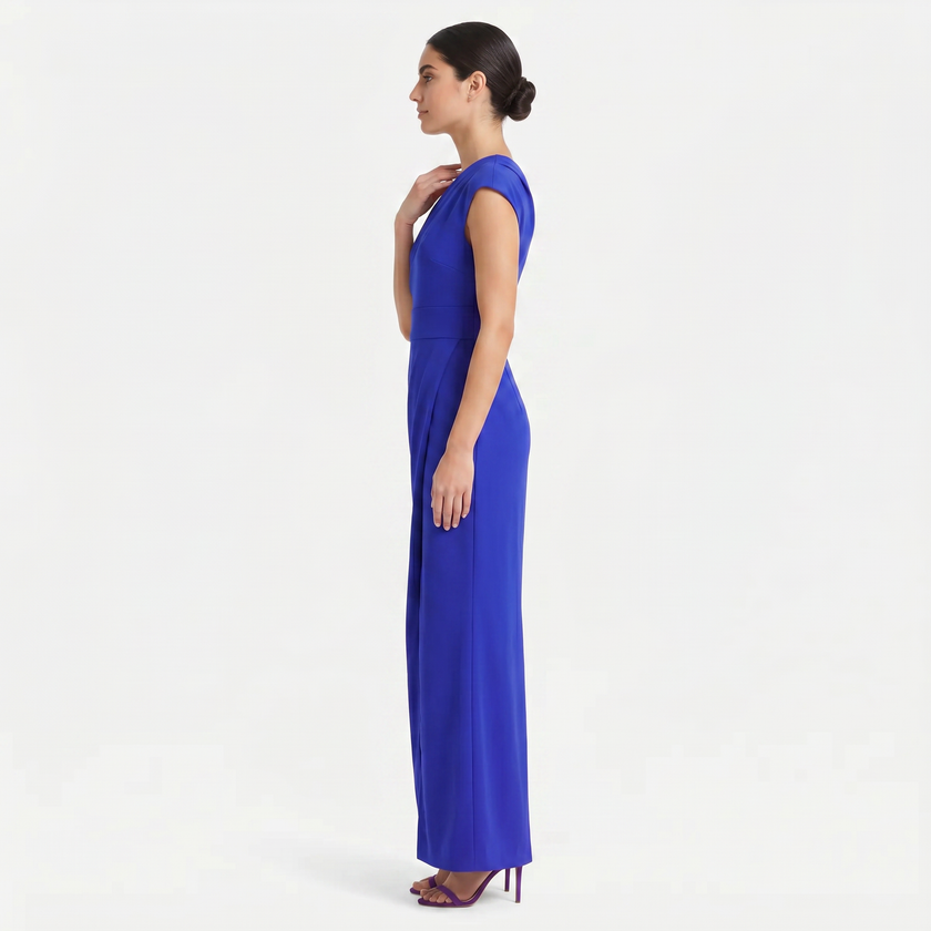 Blue women's one-shoulder maxi evening dress by FJØRNA, showing side profile with asymmetric neckline and flowing silhouette.