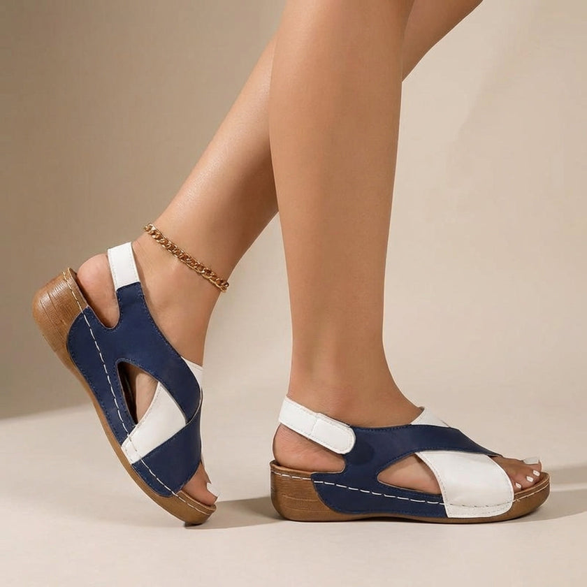 Blue FJØRNA orthopedic criss-cross slingback wedge sandals for women with supportive straps and a comfortable wedge heel.