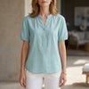 Lightweight blue denim summer blouse for women with puff sleeves and button-front design by FJØRNA.