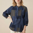 Blue FJØRNA summer blouse for women with geometric V-neck, stylish top perfect for warm-weather casual wear.