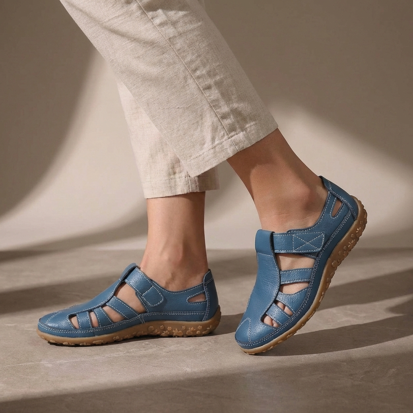 Blue FJØRNA orthopedic closed-toe sandals with cutout details and ergonomic design for comfort and support.