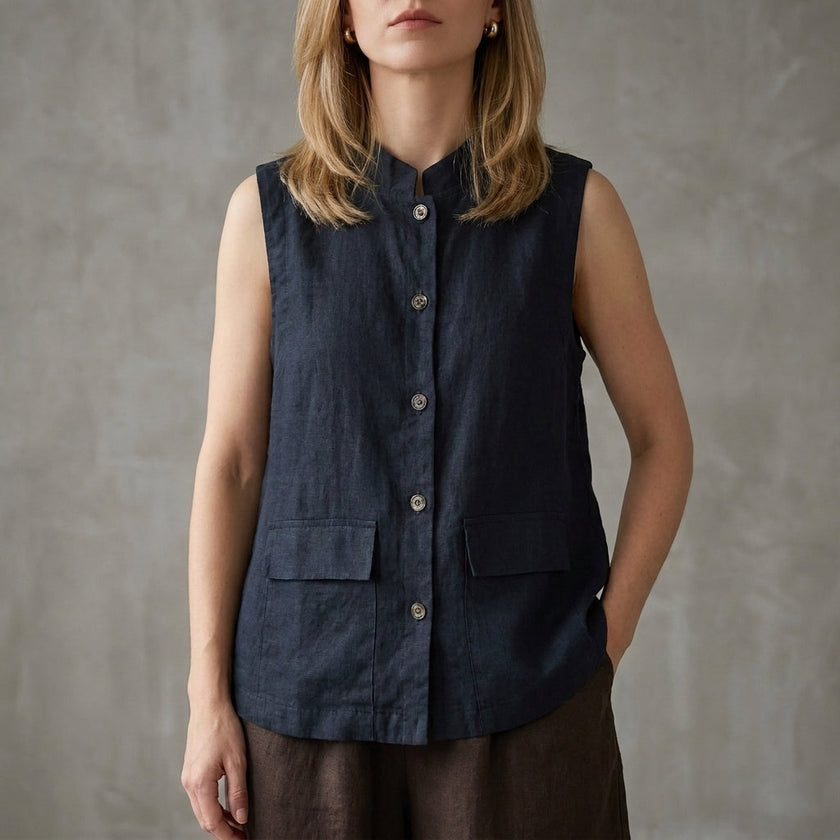 Blue sleeveless denim summer blouse for women with button front, stylish top by FJØRNA.