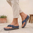 Blue FJØRNA orthopedic open toe wedge flip-flops with floral embellishments, featuring cushioned soles and stylish design.