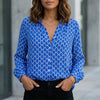 Blue women's summer blouse with geometric V-neck and long sleeves from FJØRNA, stylish and lightweight for warm weather.
