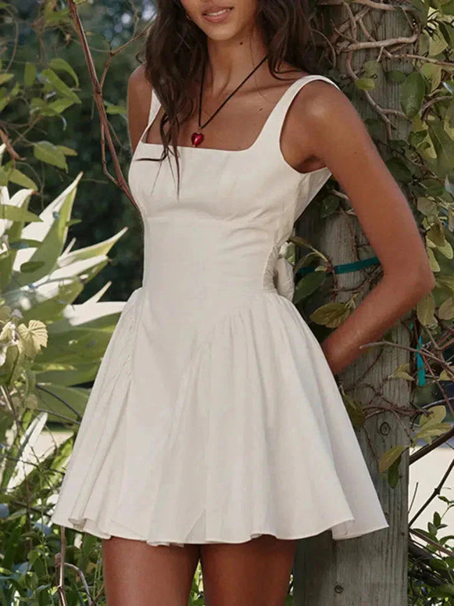FJØRNA white bow waist backless mini dress, sleeveless design with a fitted silhouette, perfect for stylish summer occasions.