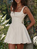 FJØRNA white bow waist backless mini dress, sleeveless design with a fitted silhouette, perfect for stylish summer occasions.