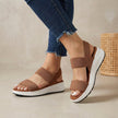 Brown FJØRNA women's orthopedic sandals with adjustable straps and flowy design, perfect for comfortable everyday wear.