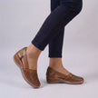 Brown FJØRNA orthopedic wedge sandals with scalloped trim and side cut-outs, showcasing stylish and comfortable summer footwear.