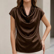 Brown FJØRNA summer blouse for women with cowl neck, short satin sleeves, stylish and lightweight for warm weather.