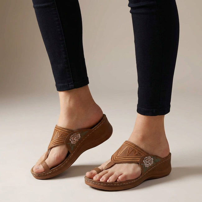 Brown orthopedic floral embroidered wedge sandals for women by FJØRNA with cushioned footbed and stylish floral embroidery.