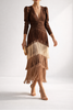 FJØRNA white midi dress with elegant fringes, featuring a flowy silhouette and stylish design perfect for special occasions.