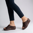 FJØRNA orthopedic platform slide sandals in brown with slip-on open toe design and cushioned footbed for comfort.