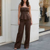 Brown FJØRNA 2-piece set with an elegant peplum cami top and wide-leg trousers, stylish and sophisticated for versatile wear.