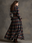 Brown FJØRNA maxi dress with a flowing casual design, featuring long sleeves and a relaxed fit, perfect for everyday wear.