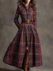 Brown FJØRNA maxi dress for women, casual style with flowing fabric and sleeveless design, shown on a model standing outdoors.