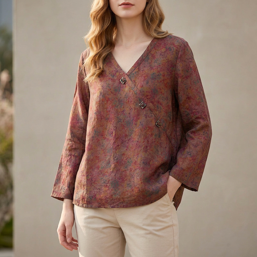 Brown FJØRNA women's summer blouse with V-neck and slit, made of lightweight linen fabric, styled as a casual top.
