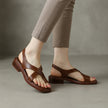 Brown FJØRNA square toe block heel criss-cross sandals for women, featuring stylish straps and a comfortable chunky heel.