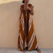 FJØRNA bohemian-inspired flowing brown A-line maxi dress with deep V-neck and geometric motifs, loose fit and elegant design.