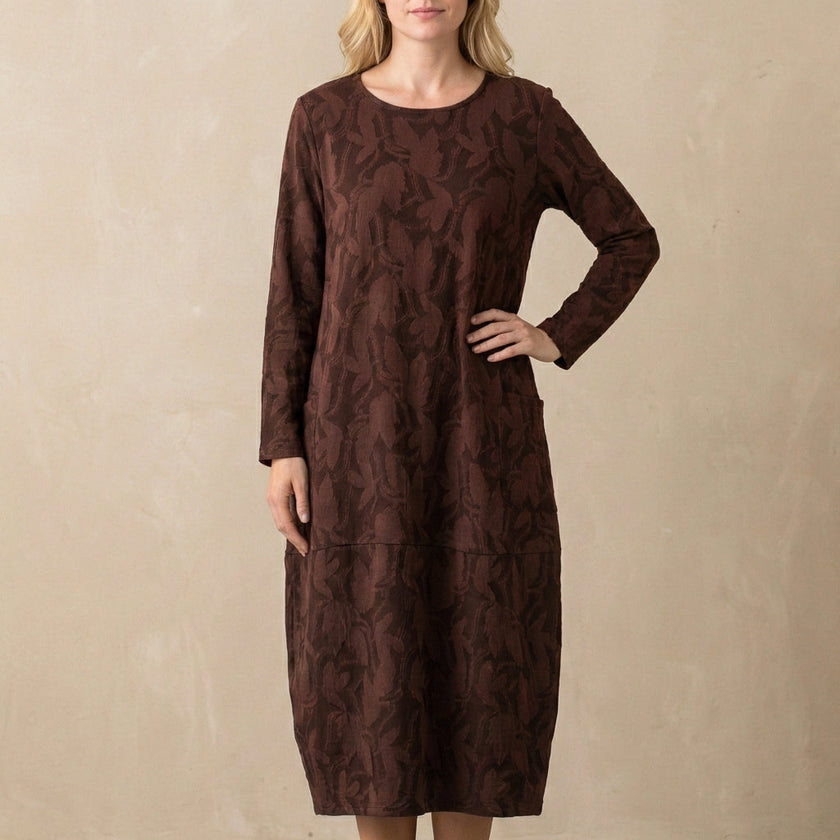 Burgundy relaxed knit maxi dress with textured pattern and patch pockets by FJØRNA, flowing and comfortable for casual wear.