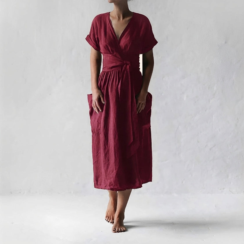 Burgundy FJØRNA elegant midi dress for women with V-neck and short sleeves, stylish and perfect for formal occasions.