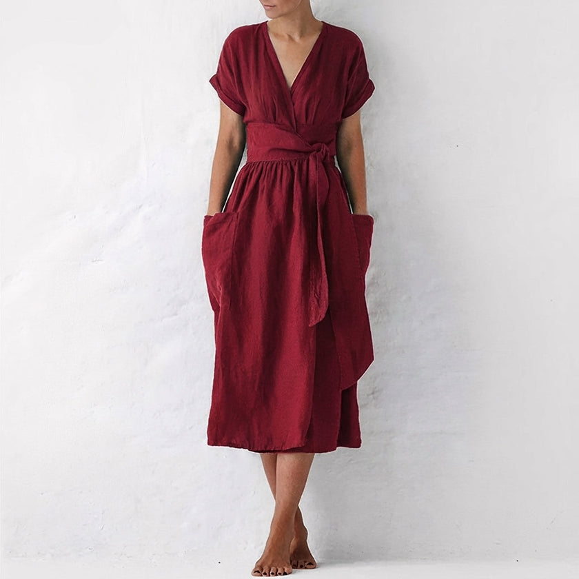 Burgundy FJØRNA elegant midi dress for women with V-neck and short sleeves, stylish and perfect for formal occasions.