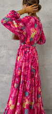 Elegant floral wrap dress for women by FJØRNA, showcasing a stylish and feminine design with vibrant flower patterns.
